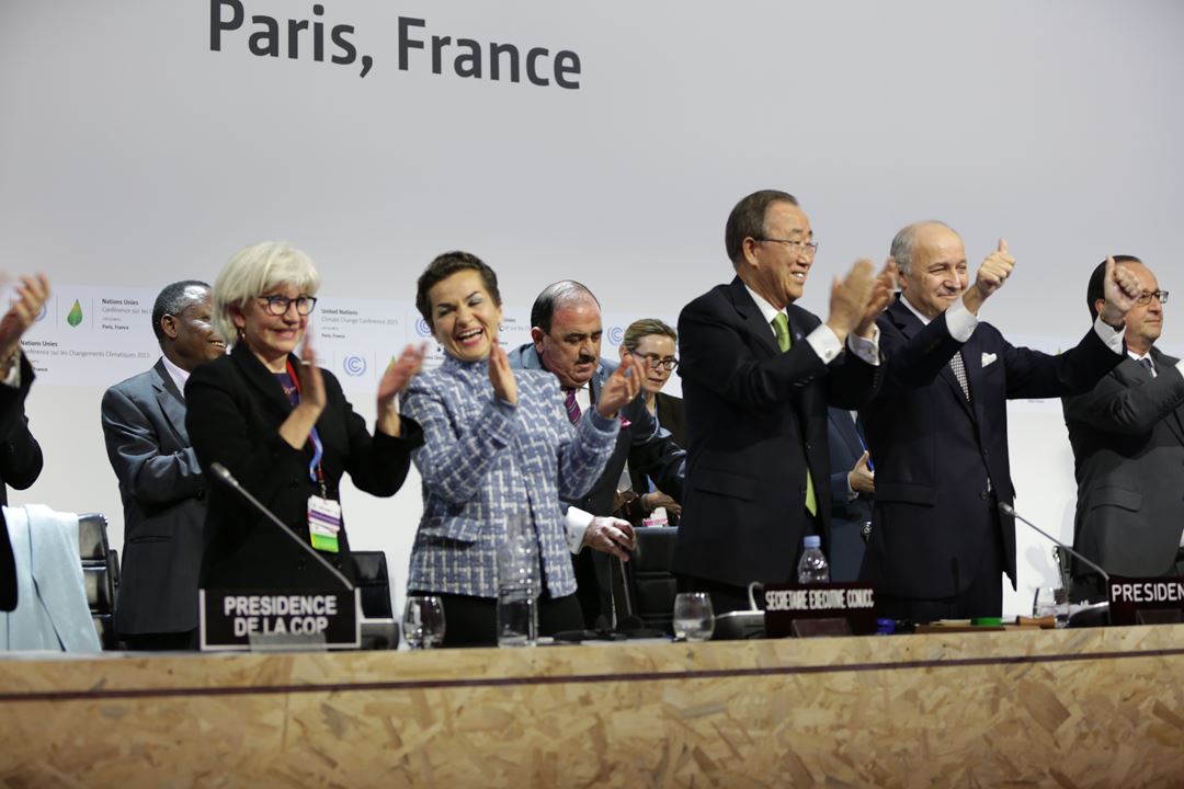 Heads of state celebrate the climate agreement signed in Paris in 2015.