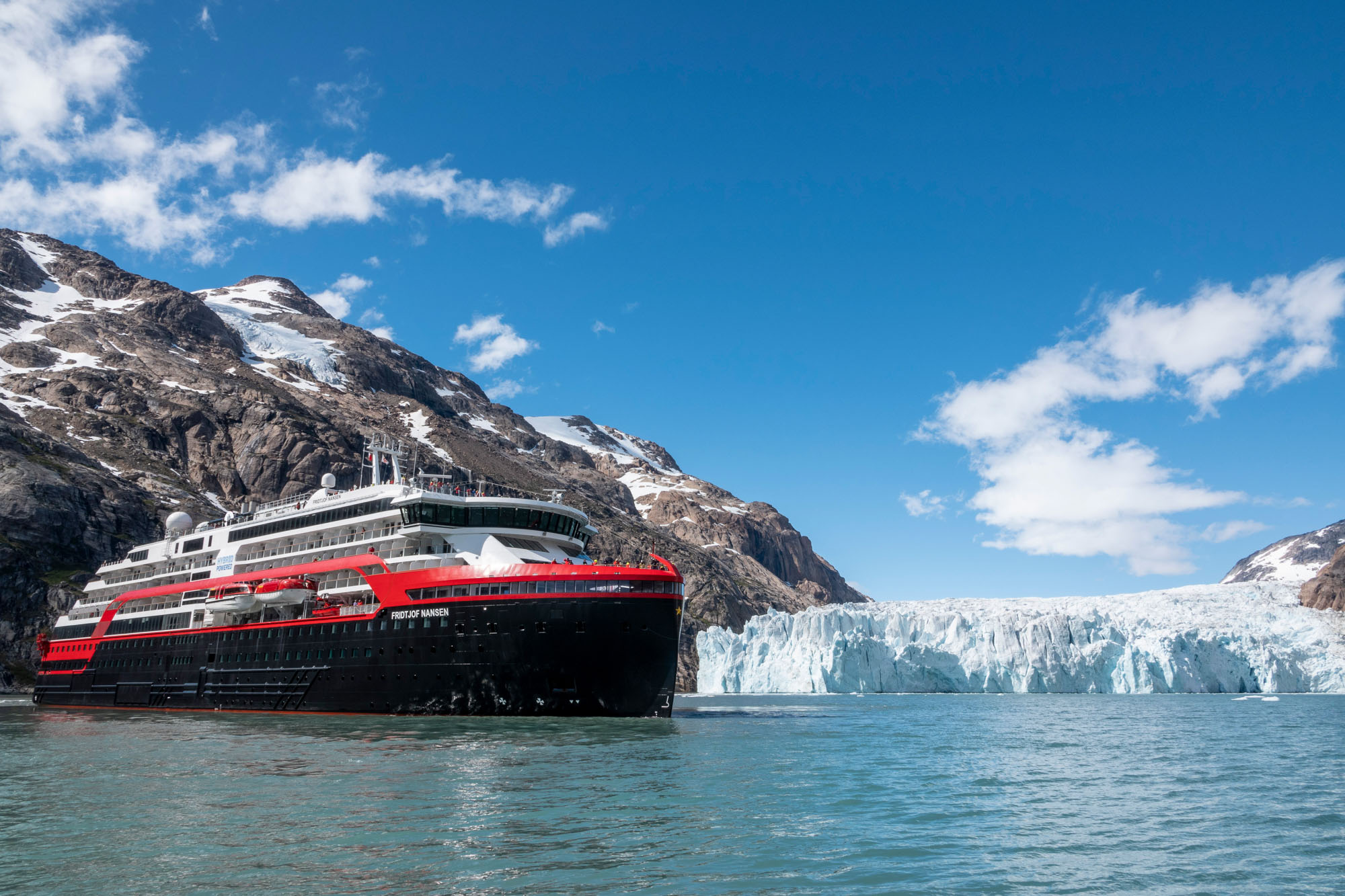 Hurtigruten cruise ship in a fjord.