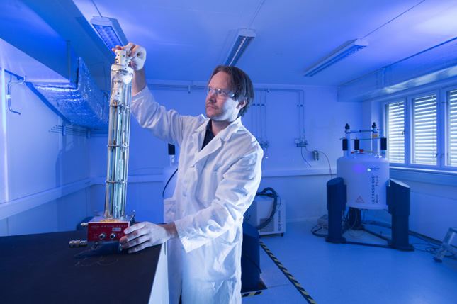 Blue picture of a person working at lab