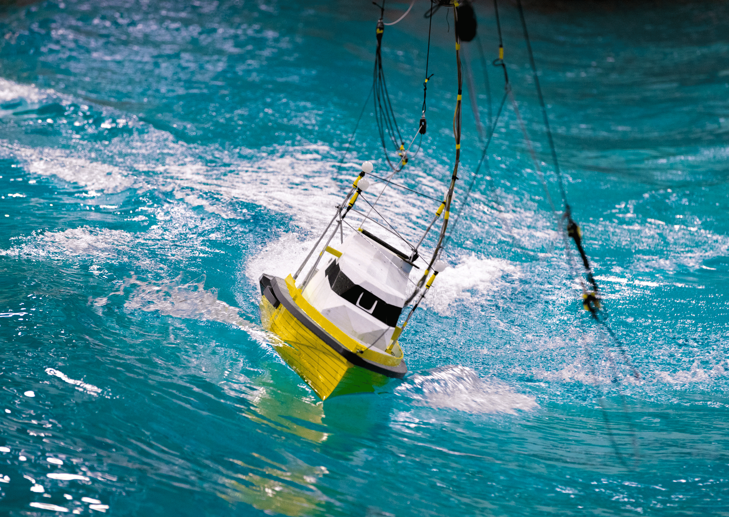 A model boat is tested in the ocean basin at SINTEF Ocean. 