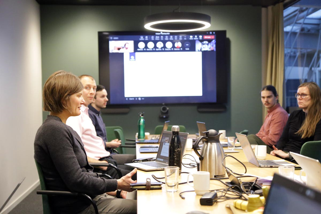 A group of people participating in a meeting.