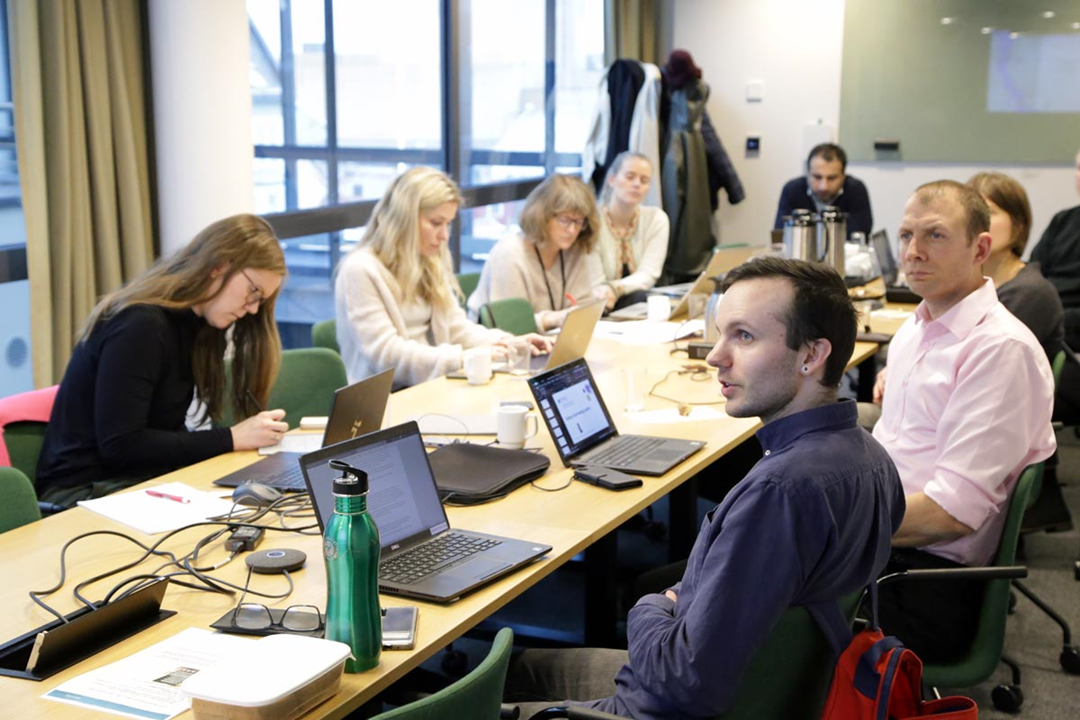 A group of people participating in a meeting.