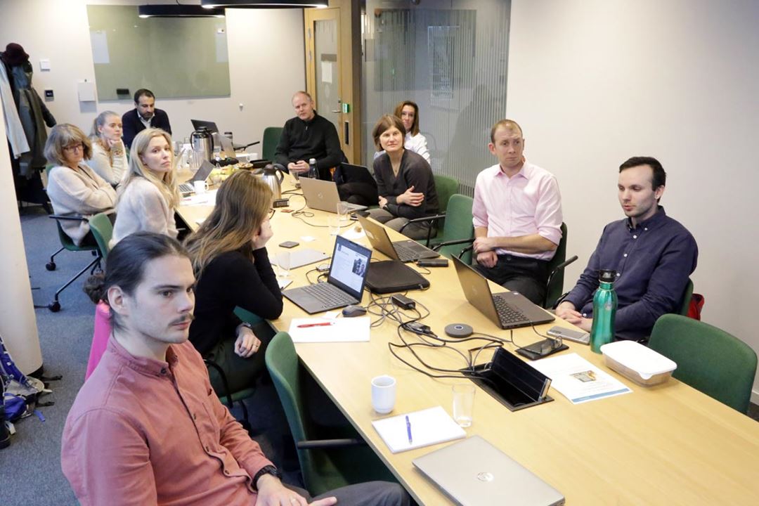 A group of people participating in a meeting.