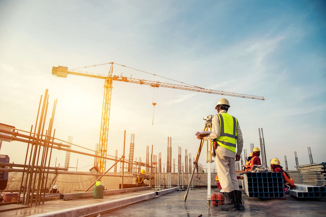 A construction worker and a crane
