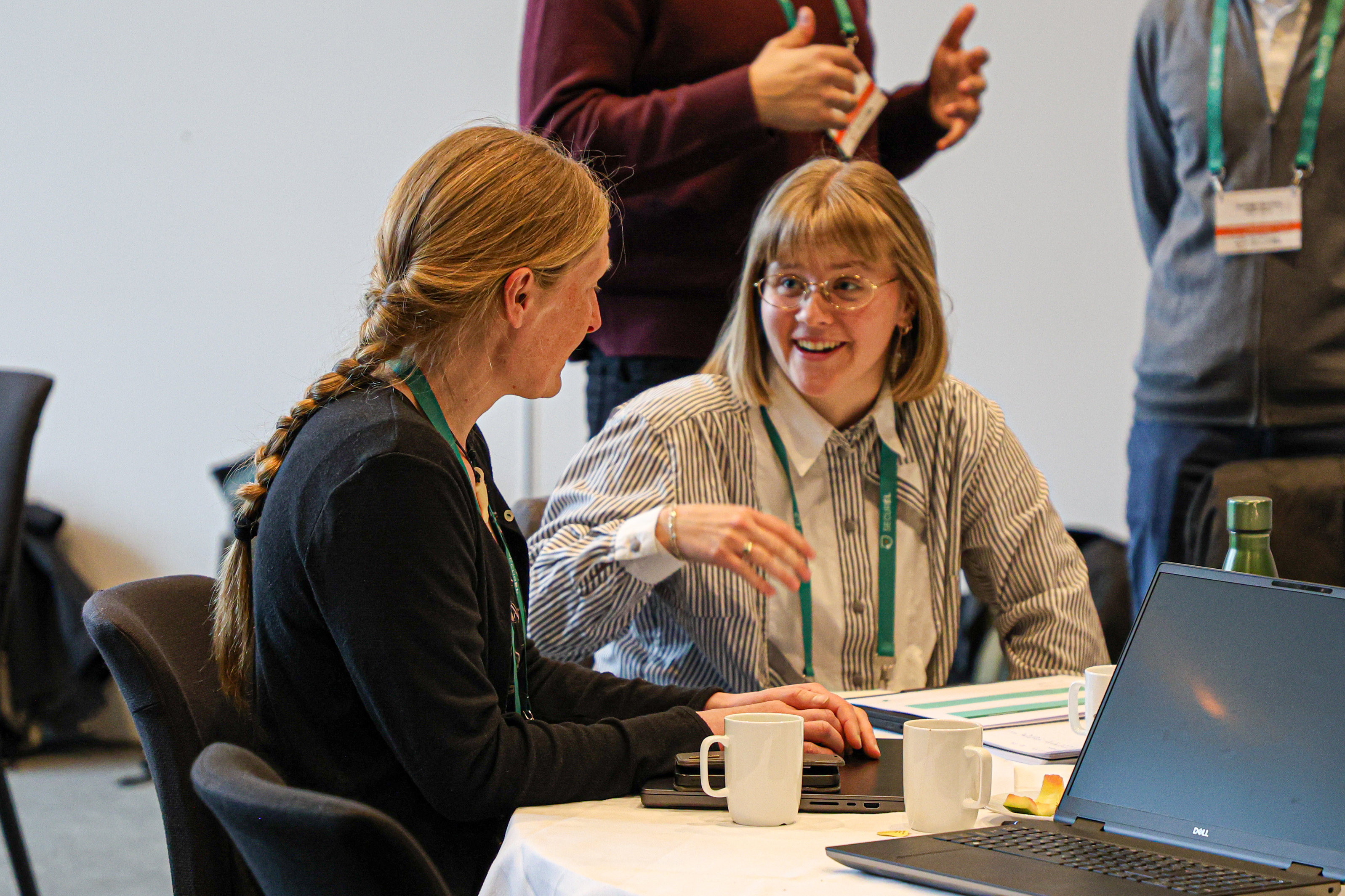 Two women chatting during group work