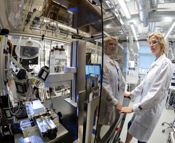 A girl on a lab in a white coat