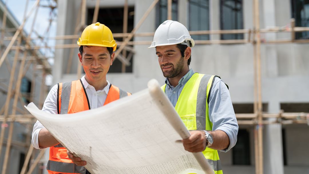Builders looking at a plan.