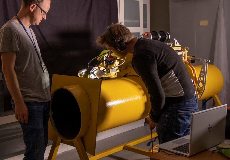 Caption: Testing robot on steel pipes.