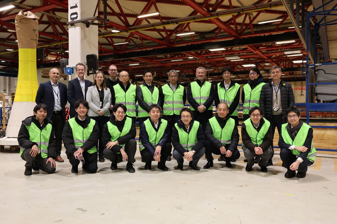 Group photo of people in yellow vests.
