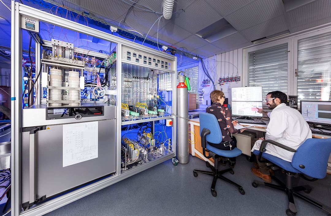 Two persones working on a catalysator