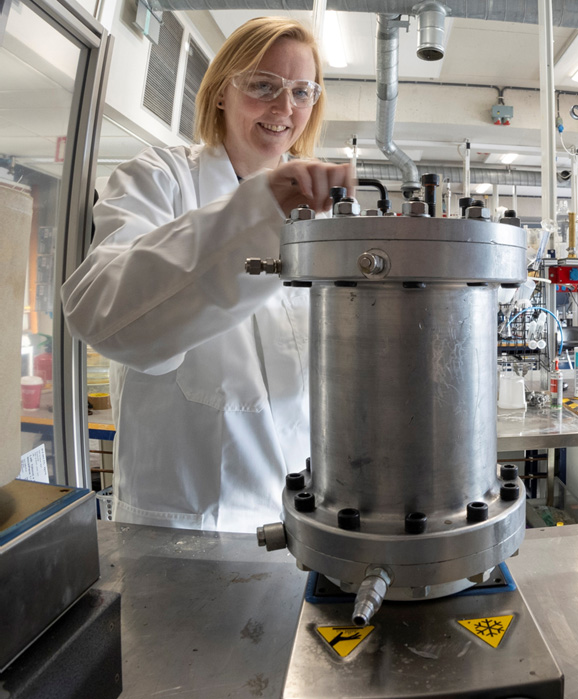 Person handles lab equipment