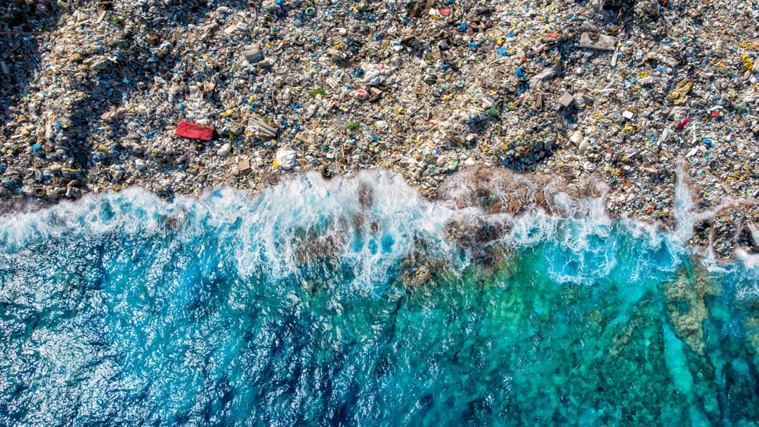 Beach littered with plastic.