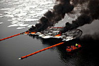 JIP Oil in ice. In situ burning of oil in fire proof boom. From large scale experiments in the Barents Sea. Foto; SINTEF