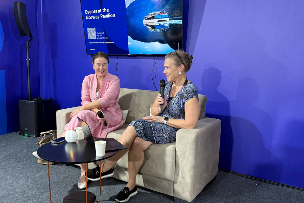 Two people sitting and talking