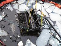Mechanical recovery of oil in ice with prototype skimmer during field experimenr outside Svalbard May 2008