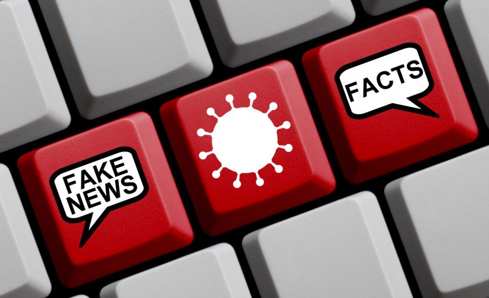 Illustrasjon med tatstatur for knapp som sjekker fakta og fake news