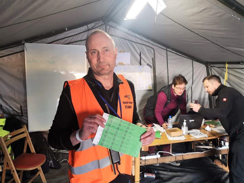 Man in orange vest