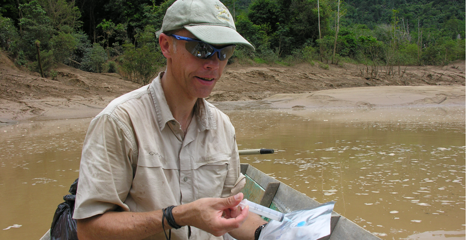 Atle Harby is preserving a gas sample at Murum River in Malaysia. The gas sample are taken to the laboratory for analysis of methane and CO2 content to give information on natural greenhouse gas emissions before a new hydropower reservoir is created on the river. Photo: Julie Bastien