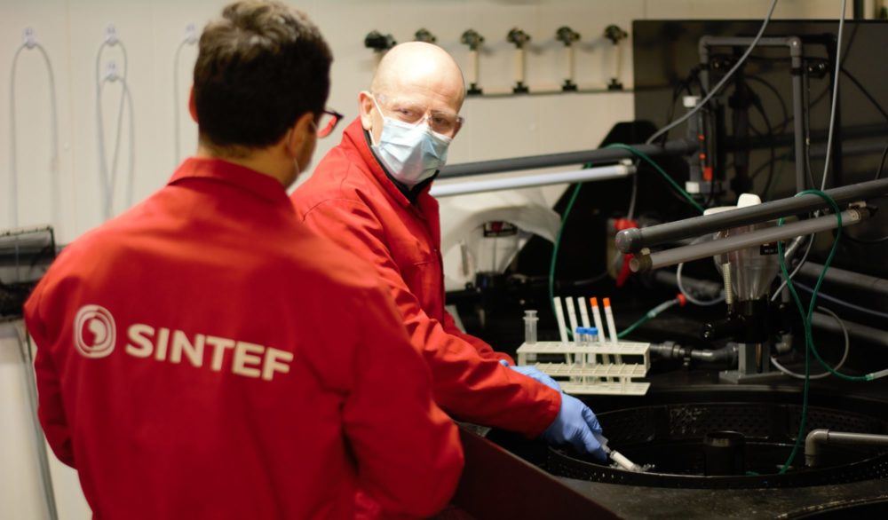 Scientists in aqua-lab