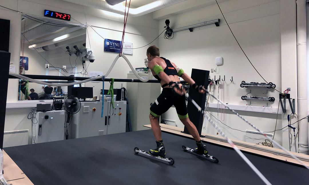 Skier on large treadmill working out