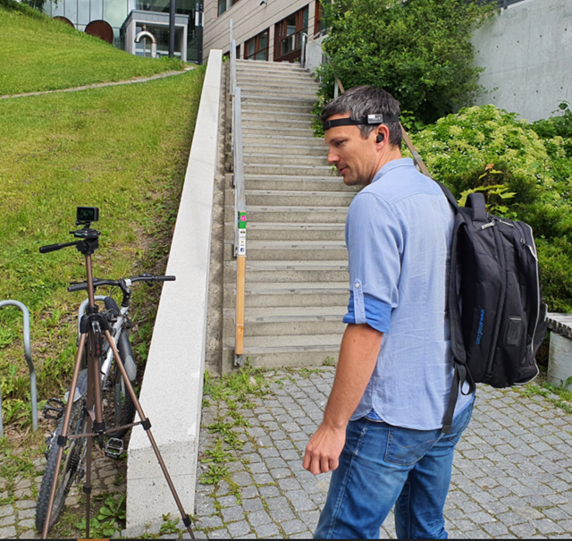 Researcher inspecting the equipment ahed of earbud-testing