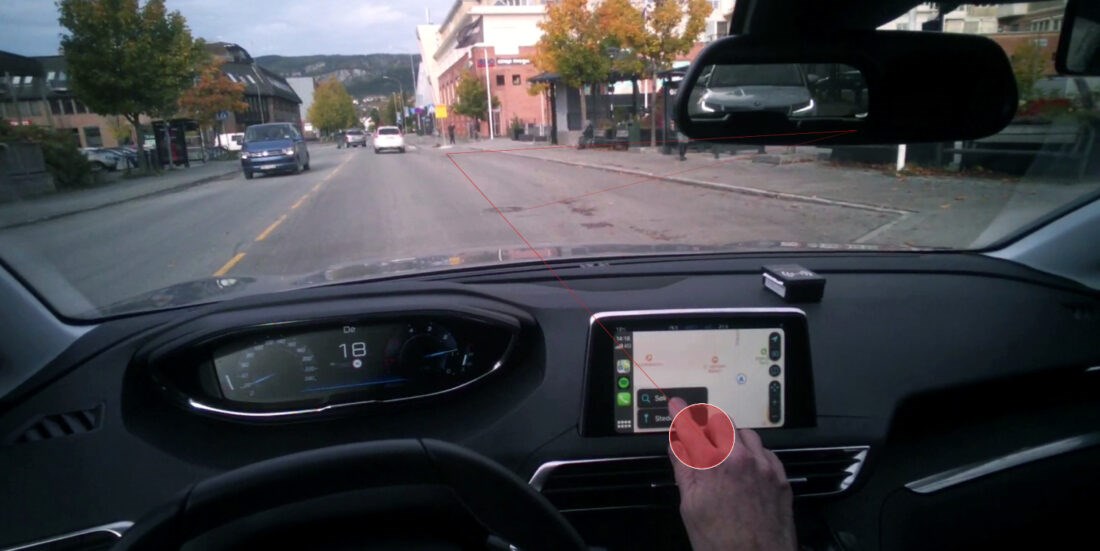 Here is the problem. When a driver touches his screen, this is where he will be looking. On average, this means that his eyes will be distracted from the traffic for half a second. The red dot shows what the driver is actually looking at. Photo: SINTEF