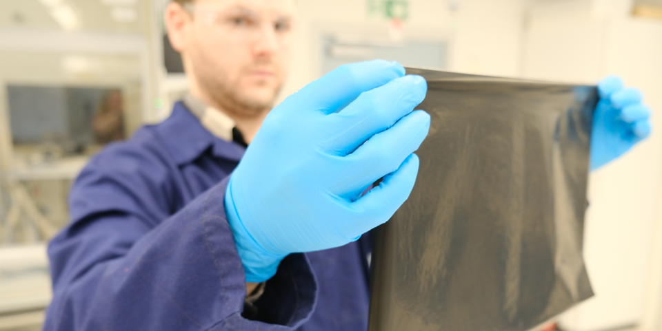 No, this isn’t a trash bag, but a new technology that is absolutely crucial in hydrogen fuel cells. Researcher Patrick Fortin shows off the new catalyst that is coated directly onto the new ultra-thin membrane. Photo: Silje Grytli Tveten